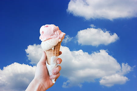strawberry icecream on cone in hand thumbnail