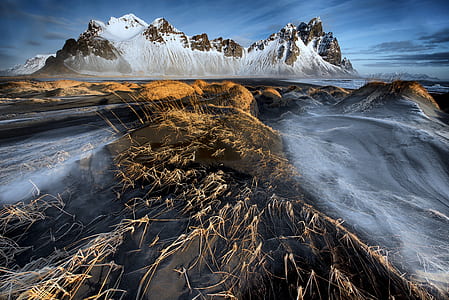 mountains with body of water shallow focus photo thumbnail