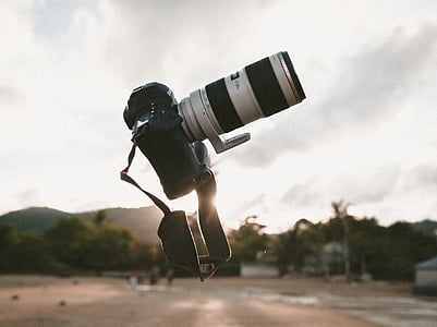 focus photo of black and silver DSLR camera thumbnail