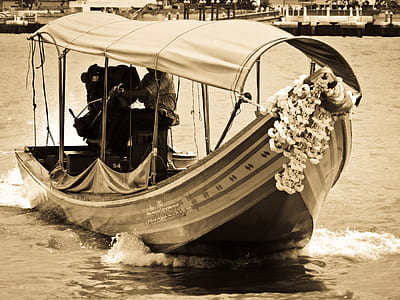 beige and black boat photo thumbnail