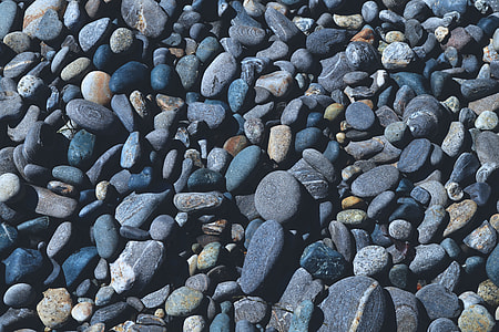 Overhead shot of pebbles on the beach thumbnail