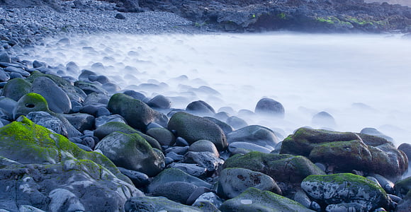 gray coastal rocks during daytime thumbnail