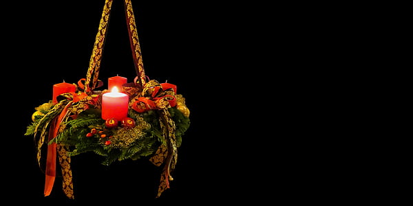 photo of red lighted pillar candle in brown hanging decor thumbnail