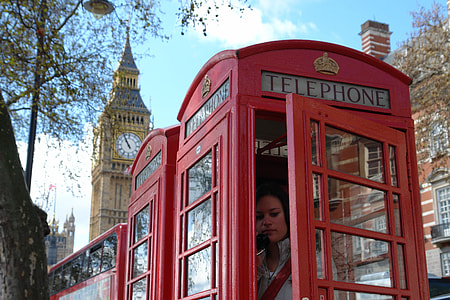 woman inside telephone booth thumbnail