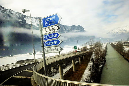 Road Sign Post Under the Cloudy Sky thumbnail