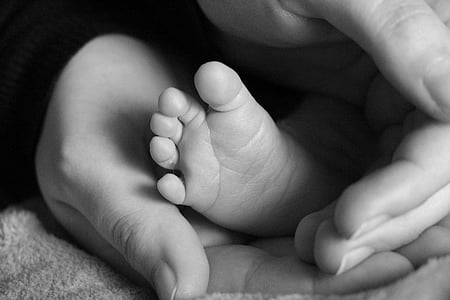 person holding baby's feet thumbnail