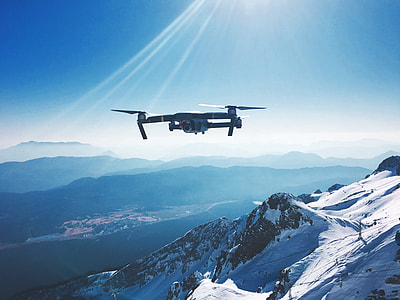 gray quadcopter drone in flight thumbnail