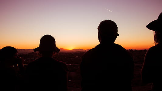 silhouette of people in front of sun thumbnail