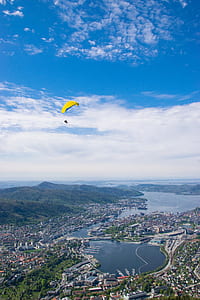 paragliding over city thumbnail