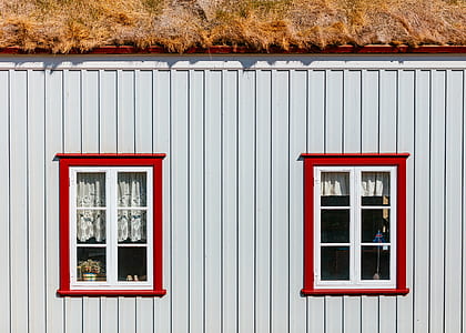 pile of hay on gray house roof thumbnail