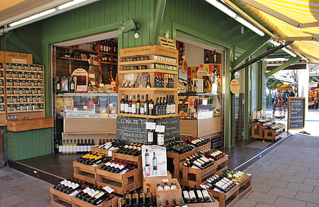 green and brown wooden store at daytime thumbnail