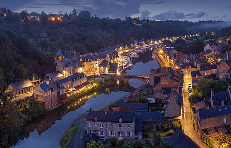 lighted village near body of water thumbnail