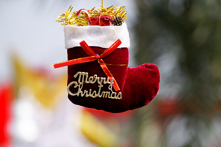 selective focus photography of red and white Christmas stocking thumbnail