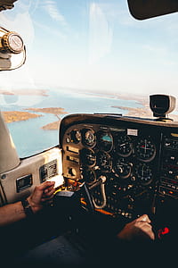 person riding plane sitting on cockpit at daytime thumbnail