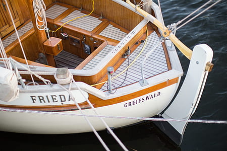 white and brown Greifswald boat on sea thumbnail