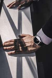 Mans Hands Lean On Ledge Photo thumbnail