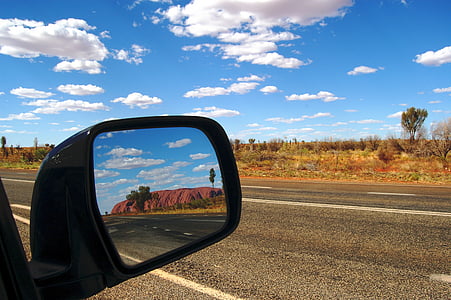 side mirror with view of concrete road at daytime thumbnail