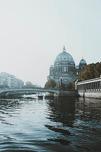 gray bridge near cathedral during daytime thumbnail