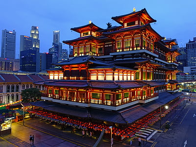 brown and black 6-layered pagoda building with lights turned on thumbnail