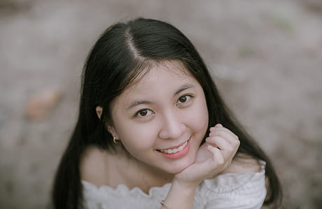Woman in White Off-shoulder Tops thumbnail