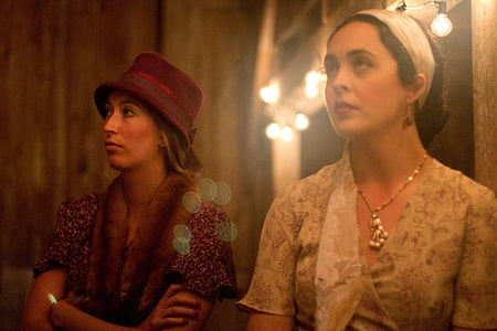 two women wearing floral dresses video still thumbnail