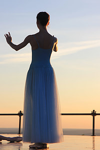 woman wearing blue spaghetti strap top photo during sunset thumbnail