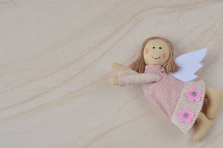 brown and white angel plush toy thumbnail