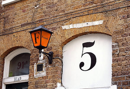 sconce near window on concrete brick structure thumbnail