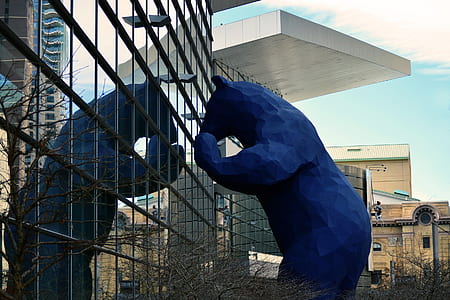 bear statue infront of building thumbnail