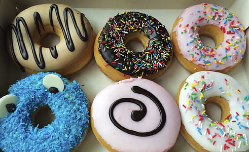 six assorted-color frosted doughnuts thumbnail