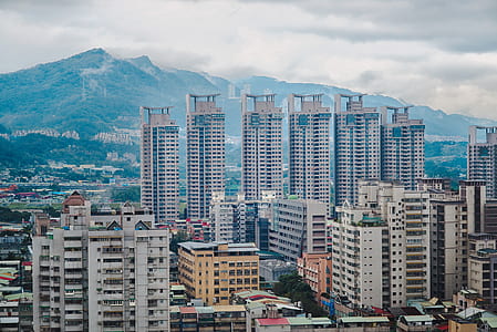 bird's eye photography of six highrise buildings in the middle of the city thumbnail