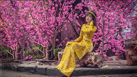 woman in yellow dress posing for photo thumbnail