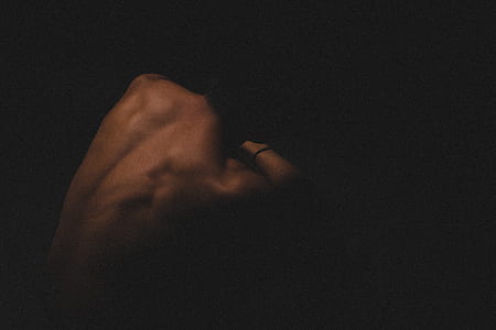 photograph of topless person on black background thumbnail