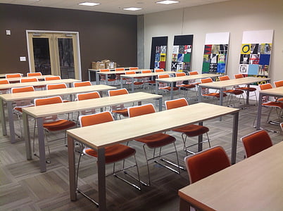 rectangular brown table with three orange chairs thumbnail