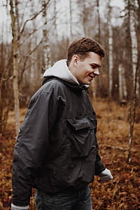 shallow focus photography of man standing thumbnail