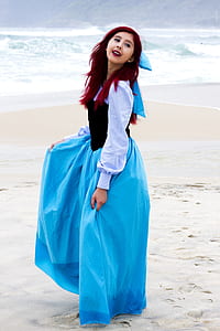 woman in white and blue long-sleeved dress thumbnail
