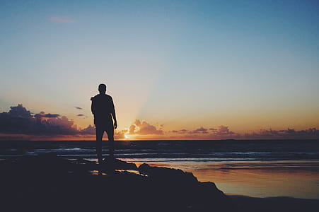 silhouette of man near beach thumbnail