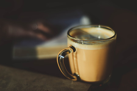 clear glass cup with brown liquid thumbnail