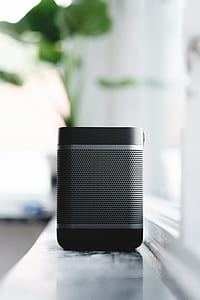 shallow focus photography of black portable Bluetooth speaker thumbnail