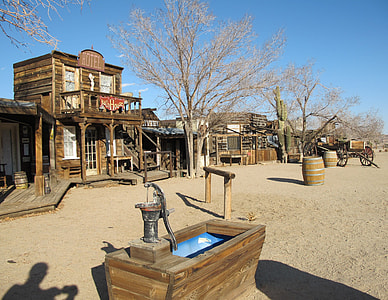 Western style town with water well and carriage during daytime thumbnail