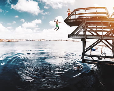 man jumps on diving board thumbnail