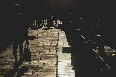 silhouette photo of group of people walking thumbnail