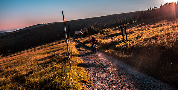person riding motorcycle on dirt road thumbnail