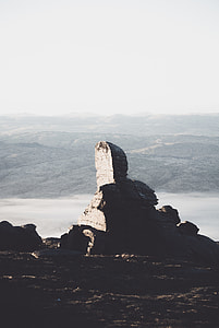 rock mountain under cloudy sky thumbnail