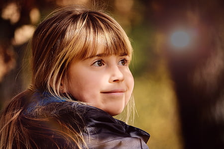 close-up photo of girl wearing black coat thumbnail
