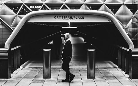 man standing in front of Crosrail Place thumbnail