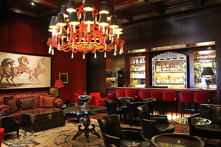 room with chairs, tables, and chandelier thumbnail