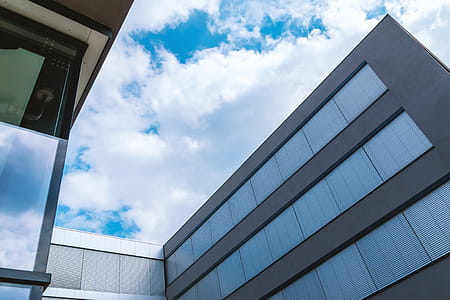 Beautiful sky with clouds above office center thumbnail