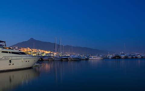 White Yacht on Body of Water during Nighttime thumbnail
