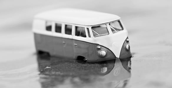 grayscale photography of Volkswagen Kombi die-cast model thumbnail